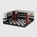 ATELIER Pont Mécanique, décor de garage en briques Mabric™ avec élévateur rouge et sol en damier