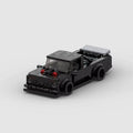 RUMBLE Launch, maquette de muscle car de dragster noire en briques Mabric™ avec cornets d'admission rouges
