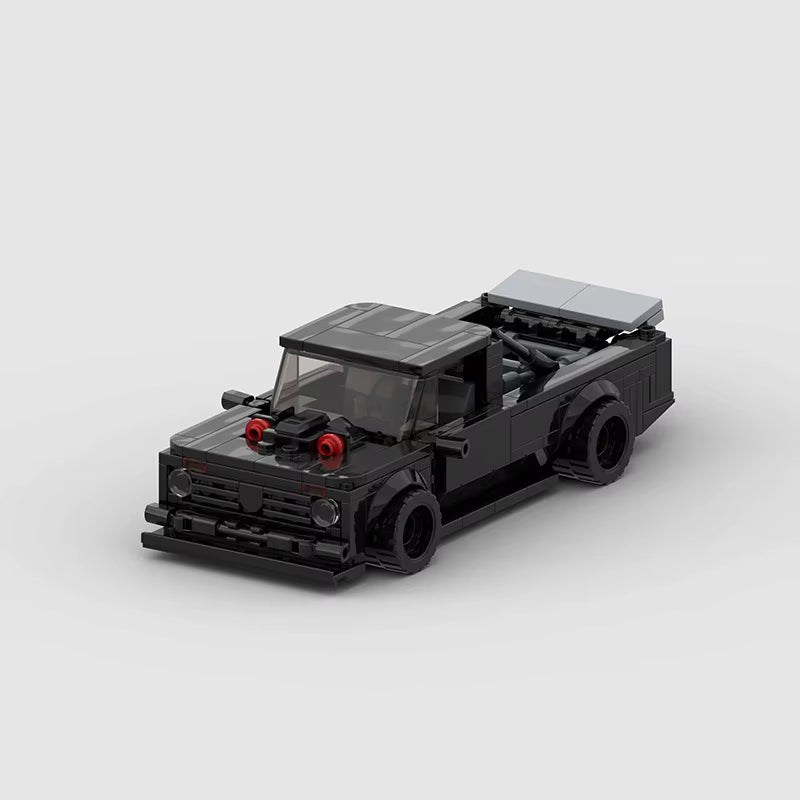 RUMBLE Launch, maquette de muscle car de dragster noire en briques Mabric™ avec cornets d'admission rouges