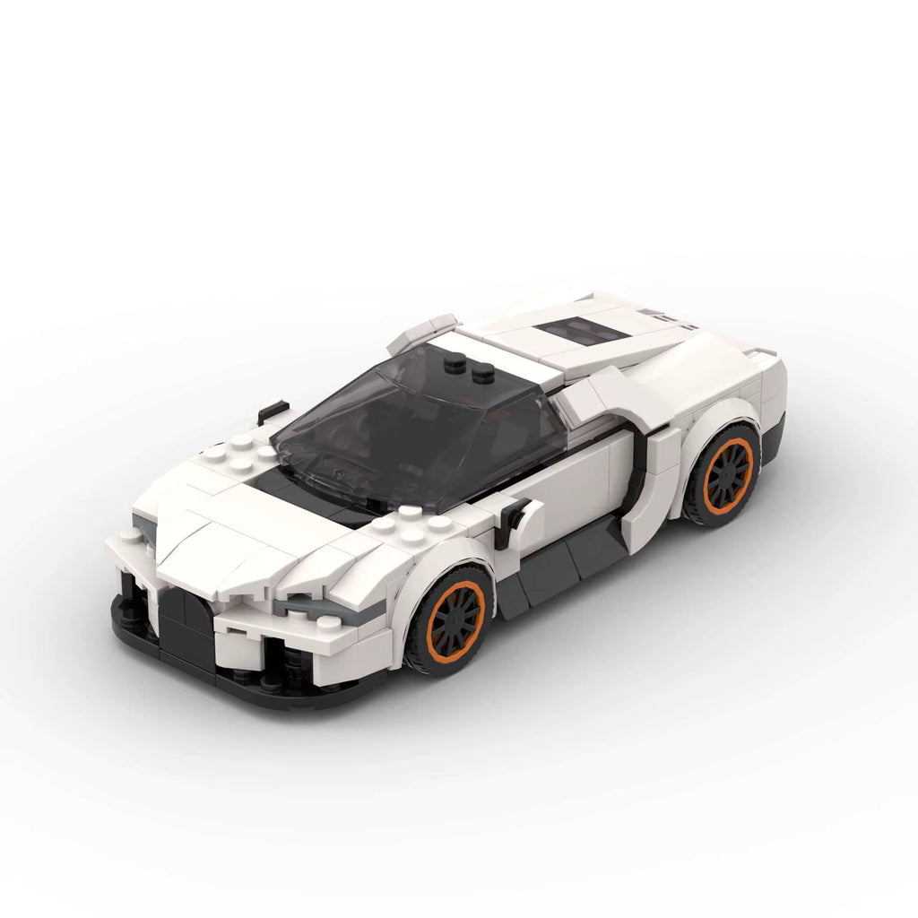 ELYTRA Cosmique, maquette d'hypercar blanche en briques Mabric™ aux jantes cerclées d'orange