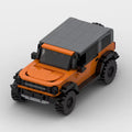 RUMBLE Savage, maquette de 4x4 tout-terrain orange et gris en briques Mabric™