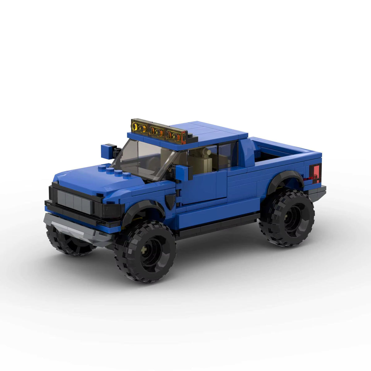 RUMBLE Outland, maquette de pick-up tout-terrain bleu en briques Mabric™ avec rampe de phares