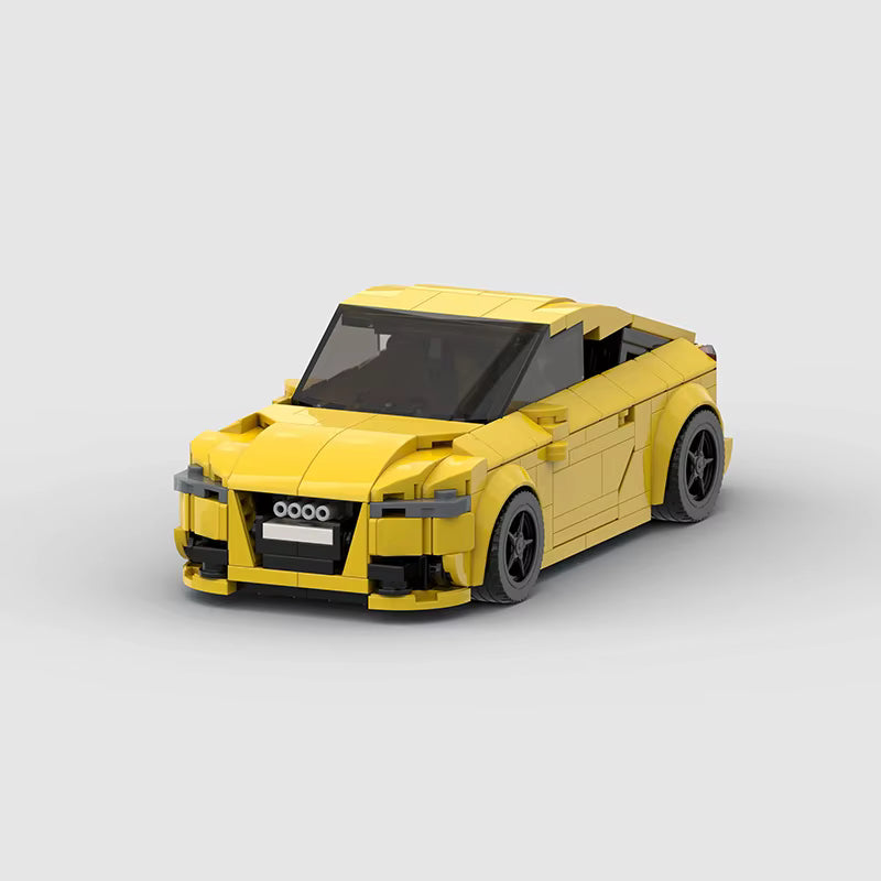 SHIELD Arc, maquette de coupé compact jaune en briques Mabric™ au pavillon en arc