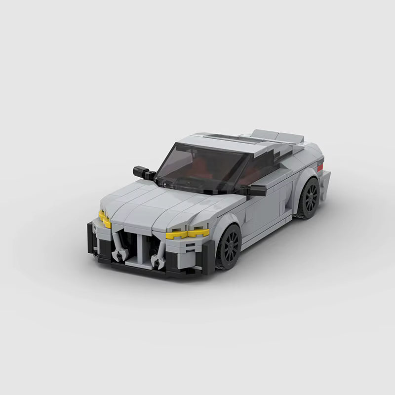KORTEX Edge, maquette de coupé sportif gris mat en briques Mabric™ aux optiques jaunes